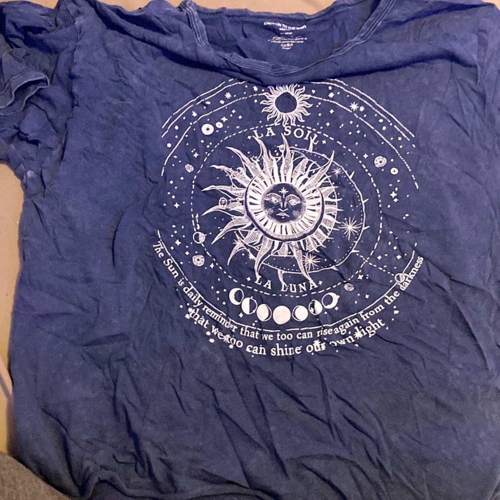 Dark bluish grey. Size medium. Brand is caution to the wind.